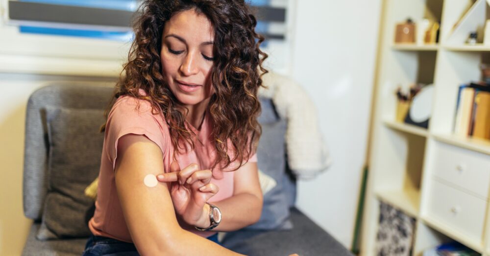Woman with a patch on her arm
